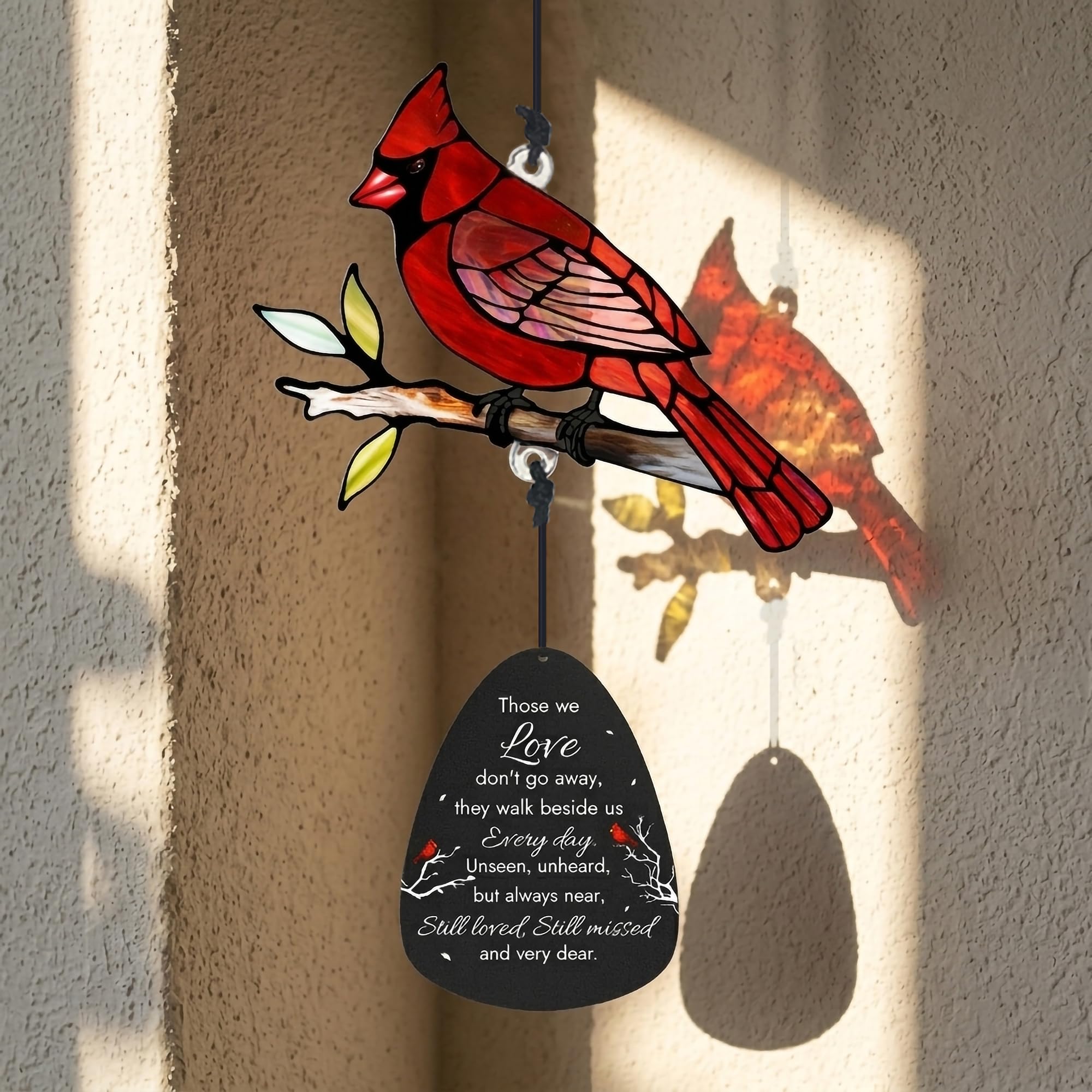 Wind chimes gently swaying in the breeze outdoors
