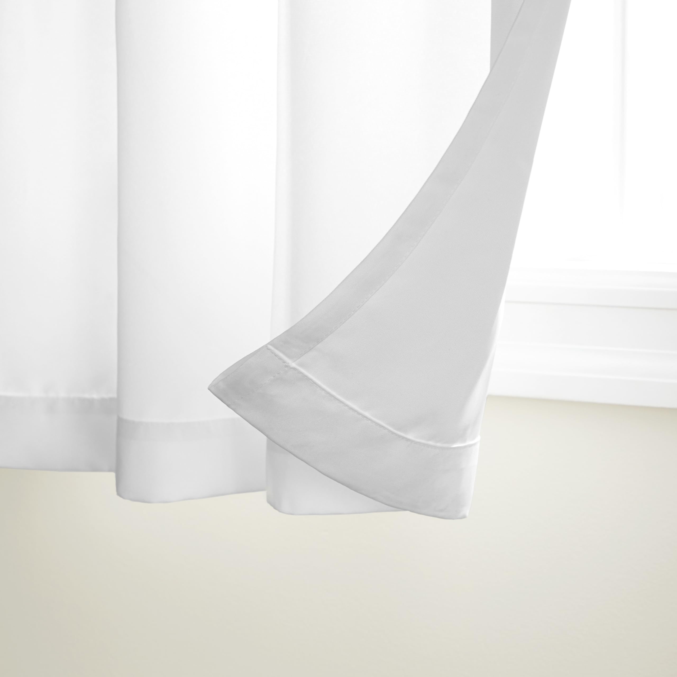 Winter White curtain panel with grommet top on a patio
