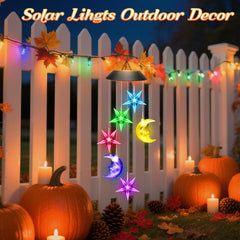 Winzwon Solar Wind Chimes on a shepherd hook in a garden