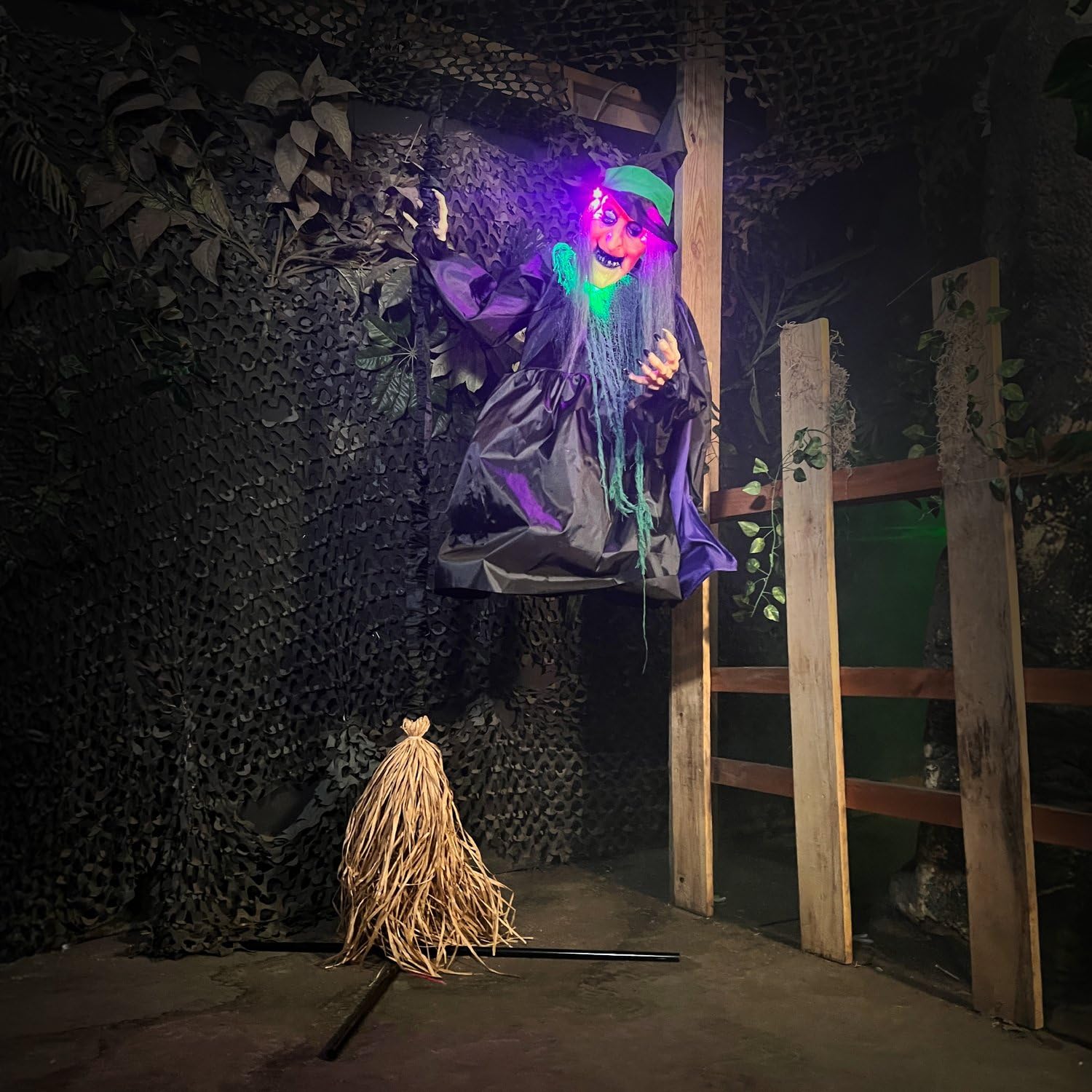 Witch animatronic set up on a porch for Halloween decoration