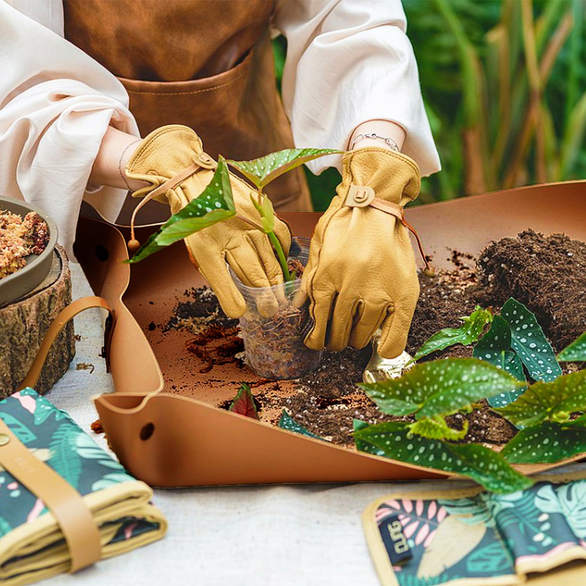 WondMall Plant Repotting Mat in use with soil and pots