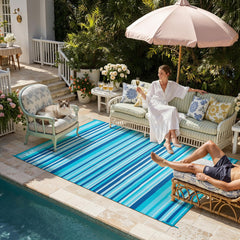 WondRg Outdoor Rug showing reversible design with blue teal stripes