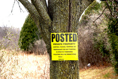 Wristco posted property sign on a fence