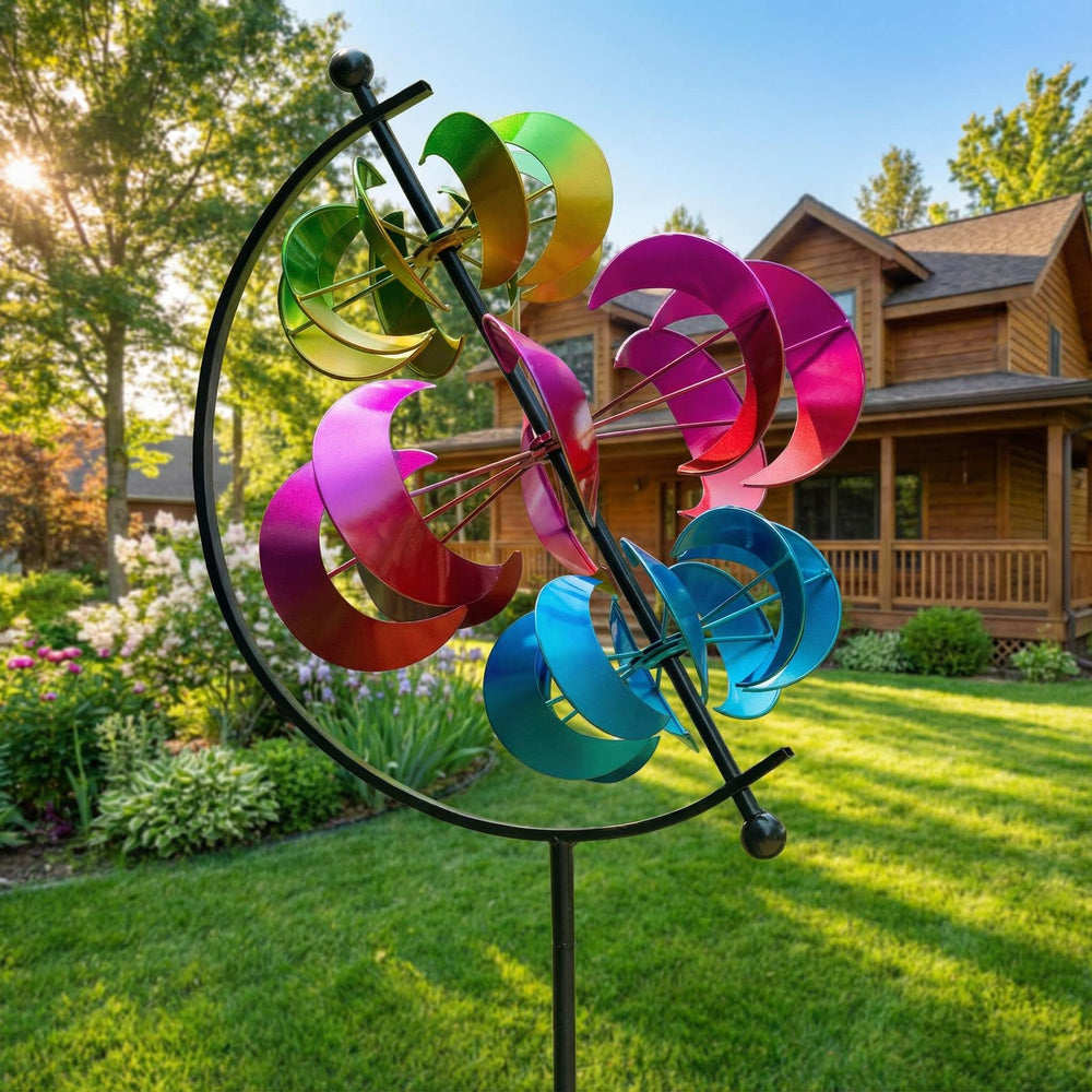 XPSCOCO wind spinner in a garden setting with flowers