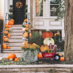 YEAHOME Fall Decorations close-up of stacked pumpkins and sunflower