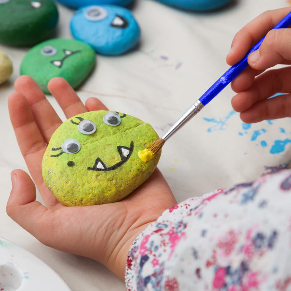 YISZM painting stones in a creative project setting