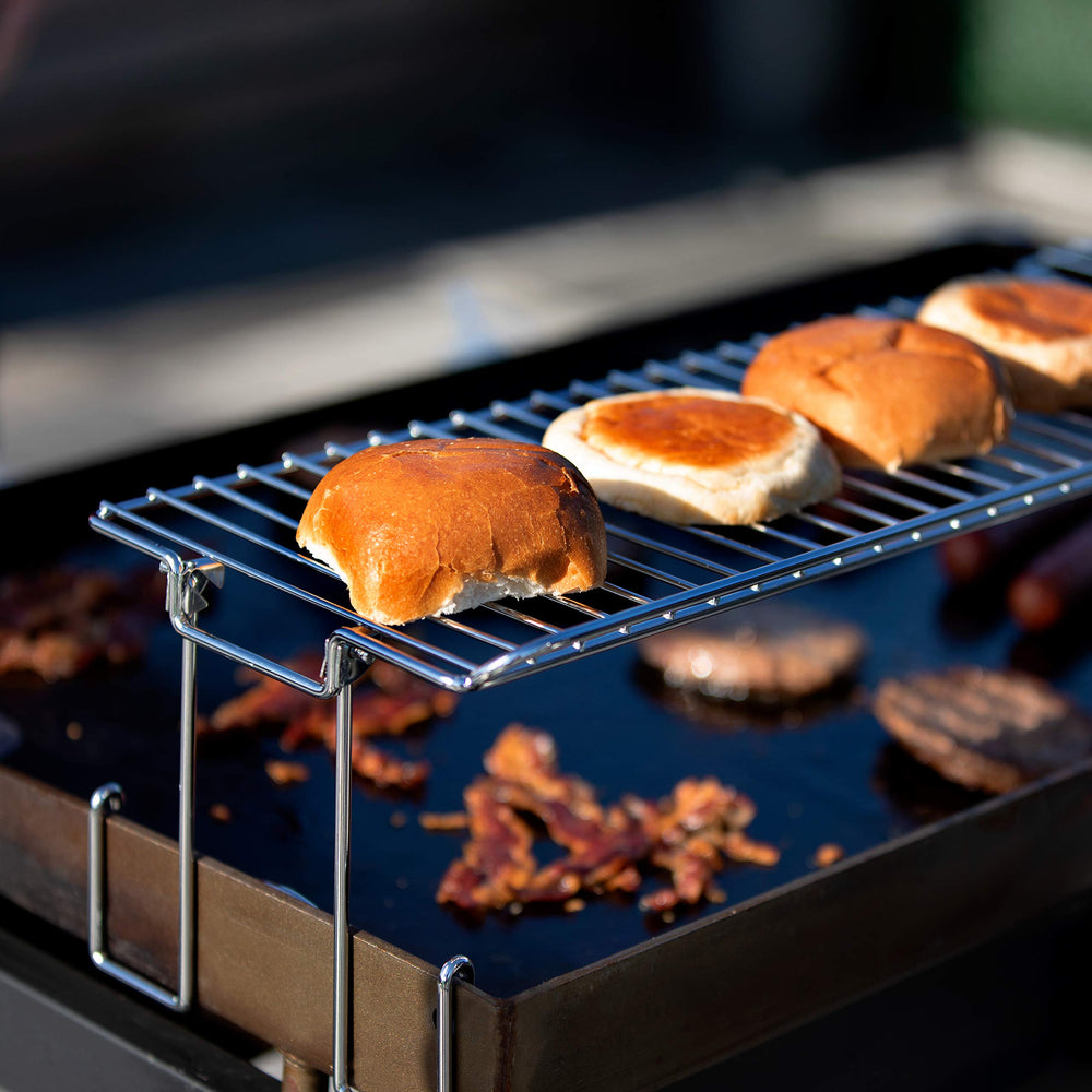 Yukon Glory griddle warming rack in outdoor cooking setting