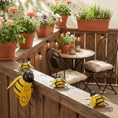 Yungeln Bumble Bee Wall Decor hanging on a fence