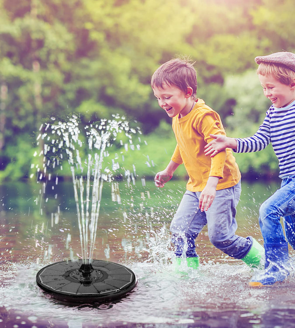 Yzert Solar Fountain with water spraying in a birdbath