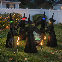 Zesua witches displayed in a garden setting