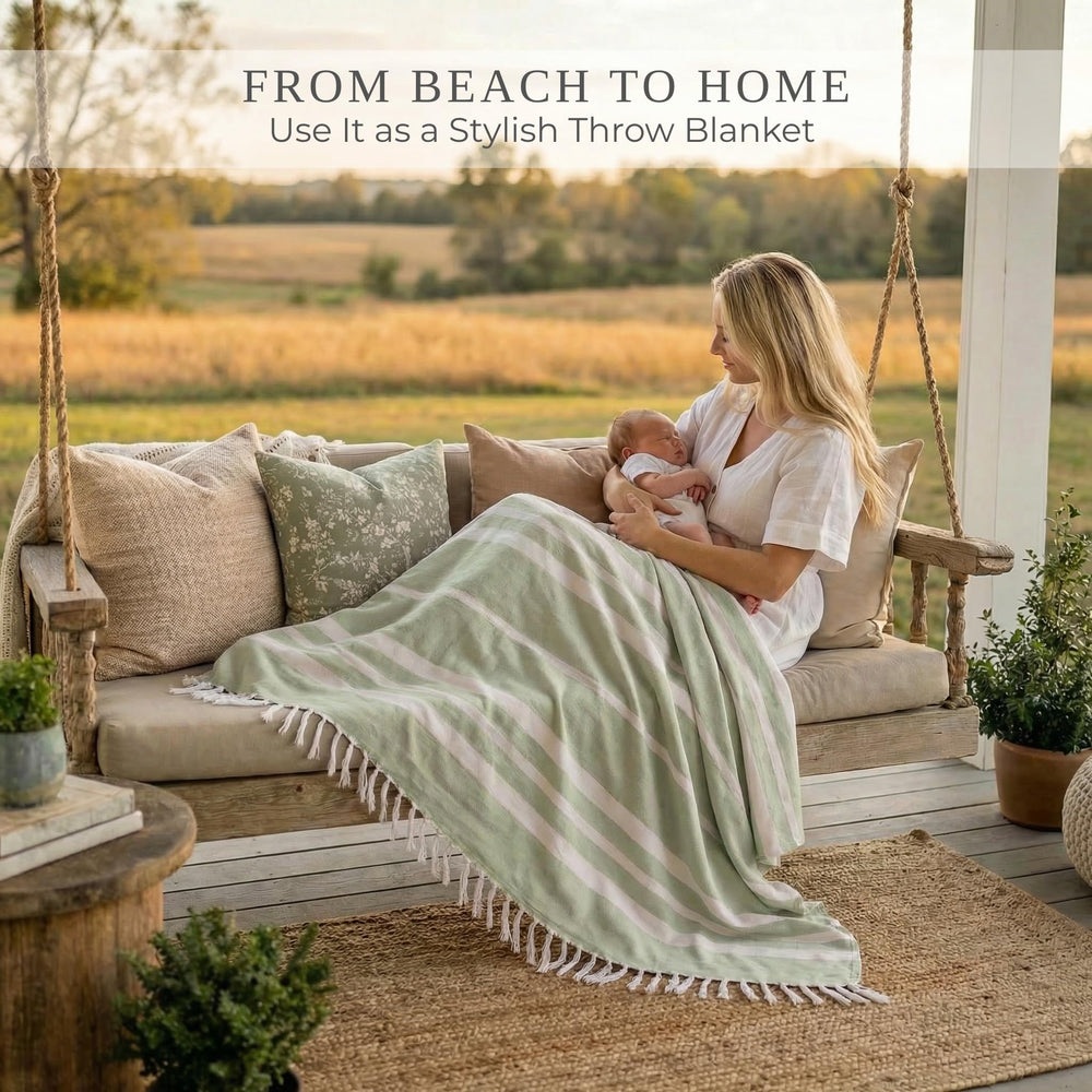 ZICOTO Beach Blanket in sage colour, lifestyle scene at the beach
