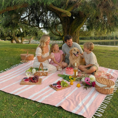 ZICOTO beach blanket spread out on sand with people relaxing